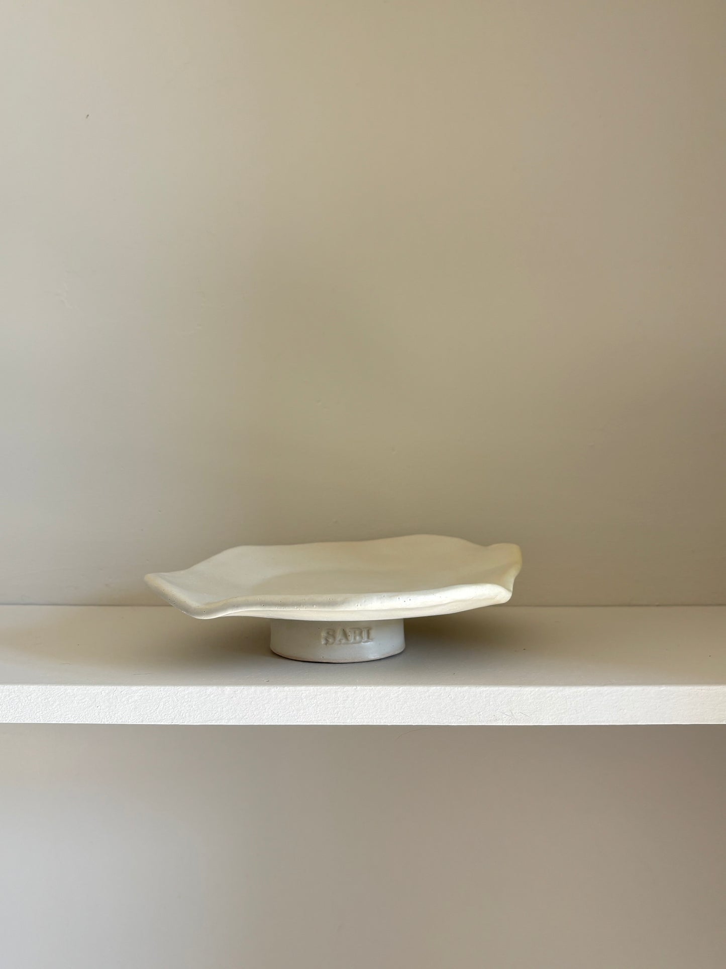 decorative stand in off white glaze