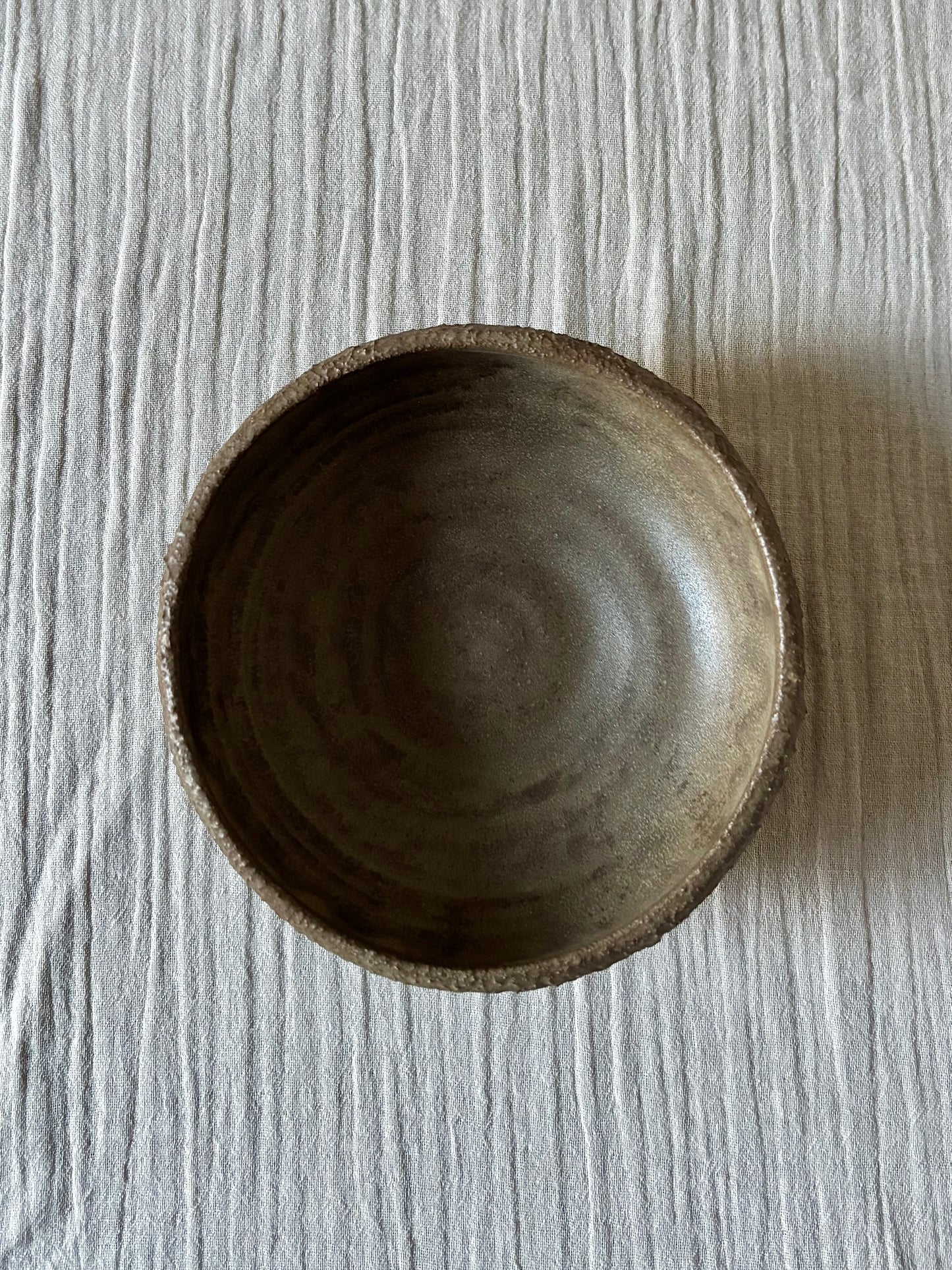 Textured bowl in brown glaze