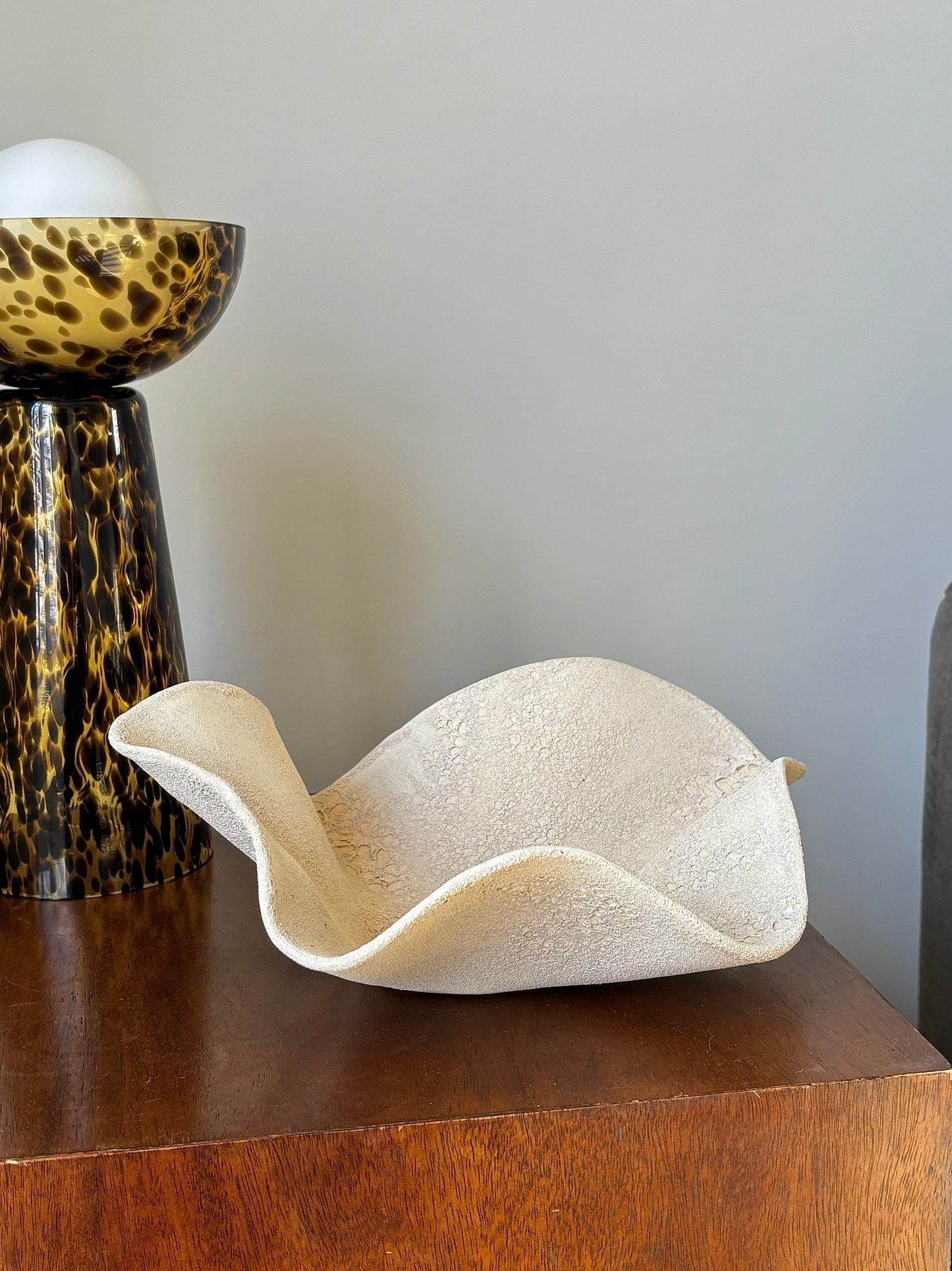Decorative sculpture in textured stone glaze