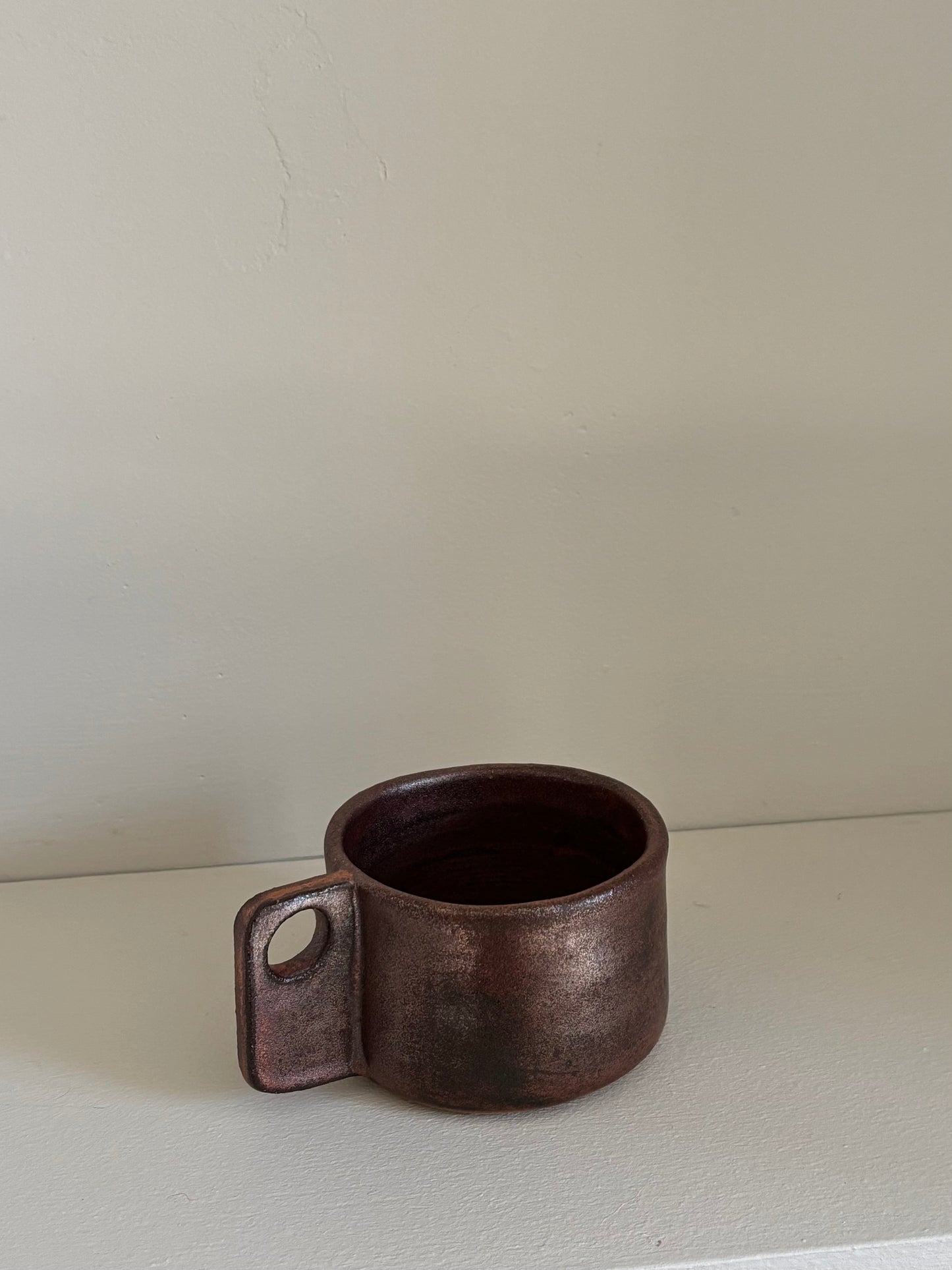 small cup in copper glaze